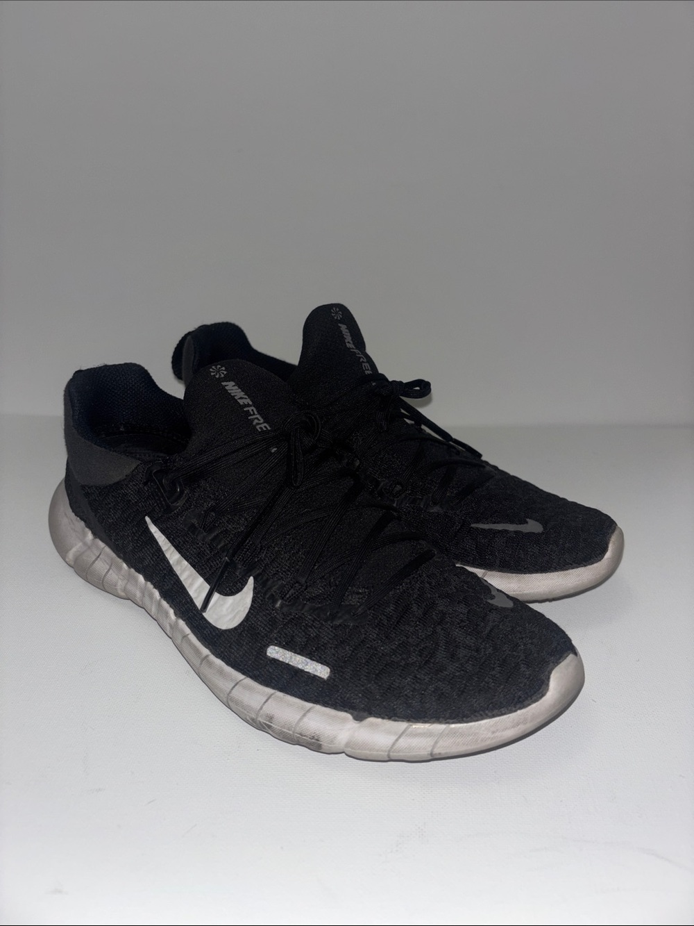 Nike Black Athletic Running Shoes with White Swoosh